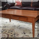 F16. Maple coffee table with two drawers. 18”h x 48”w x 23”d 